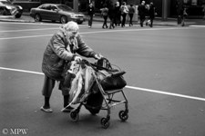 Slow and painful crossing Queen St, Auckland, black and white